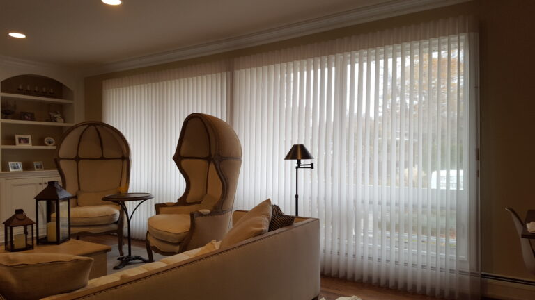 Luminette privacy sheers covering a wide sliding glass door in a living room