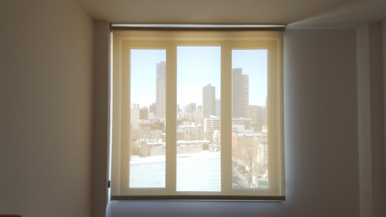 Custom roller shades fitted in a living room in Bergen County, NJ