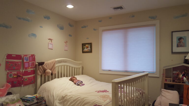 Cellular honeycomb shades in a Bergen County bedroom