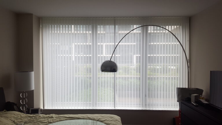 Vertical privacy sheers in a bedroom in a Bergen County home