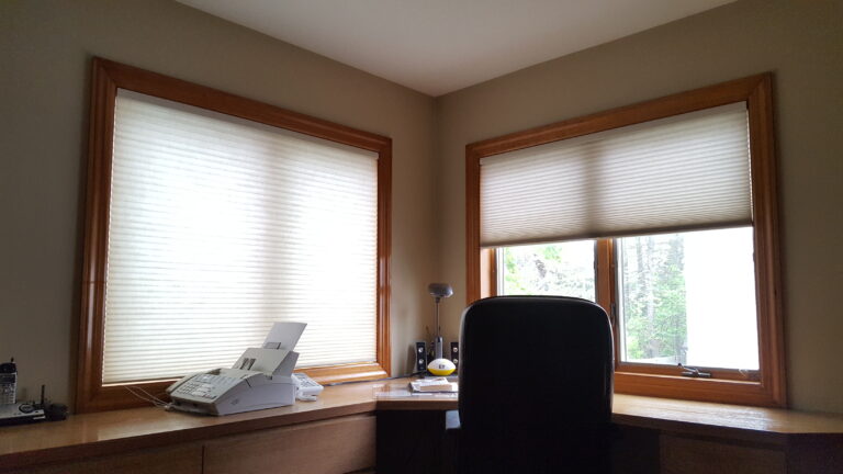 Honeycomb cellular shades in Desert Sands, showing the pleated cell structure across a window