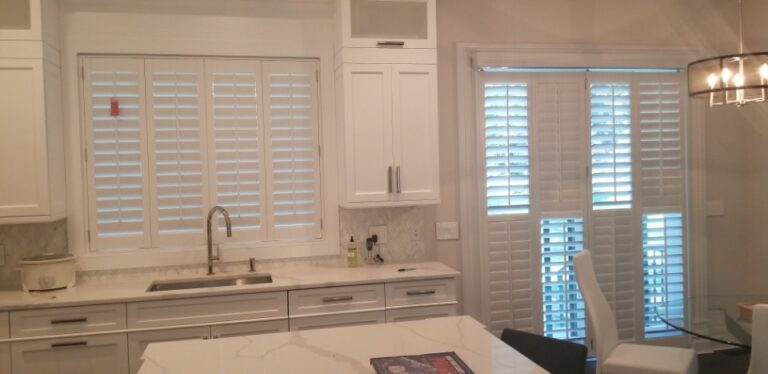 Plantation shutters at a kitchen window and on a pass through