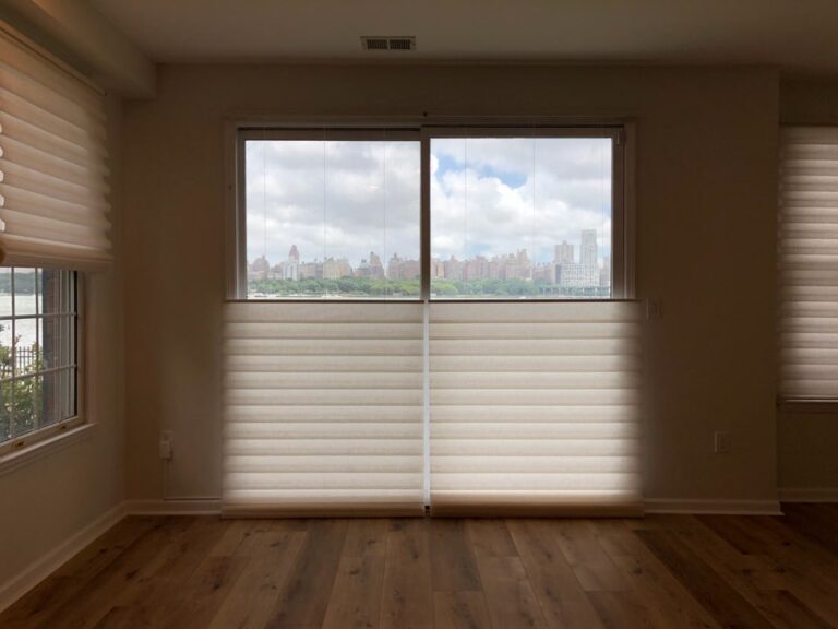 Roman shades installed in a New Jersey living room across floor-to-ceiling windows