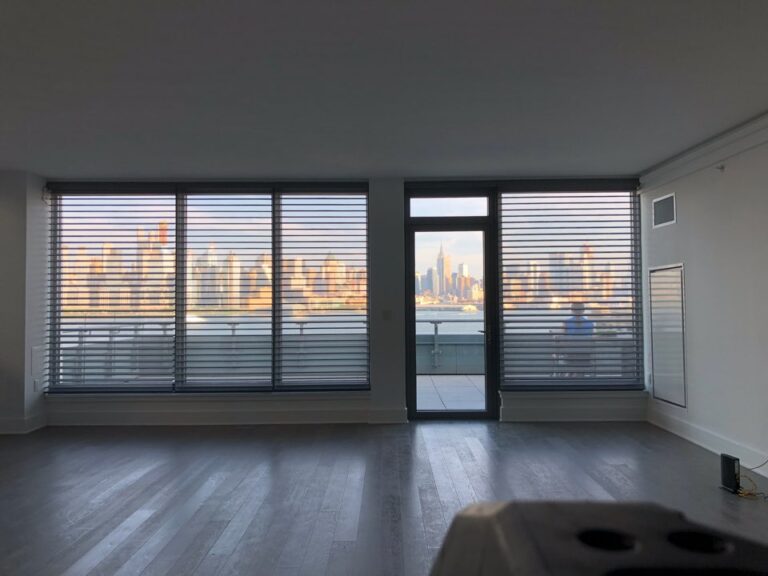 Silhouette ClearView shadings on floor to ceiling windows with a Manhattan skyline view