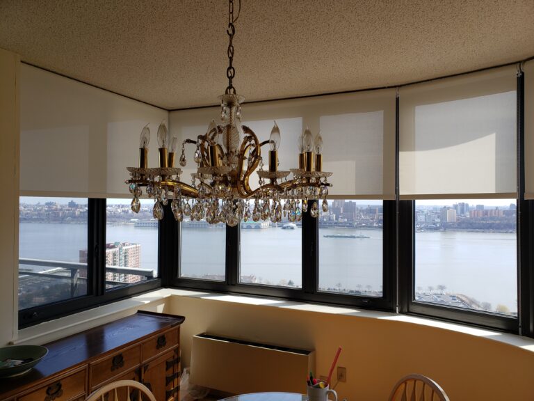 roller shades in a Tri-State dining room across floor-to-ceiling windows, made to measure