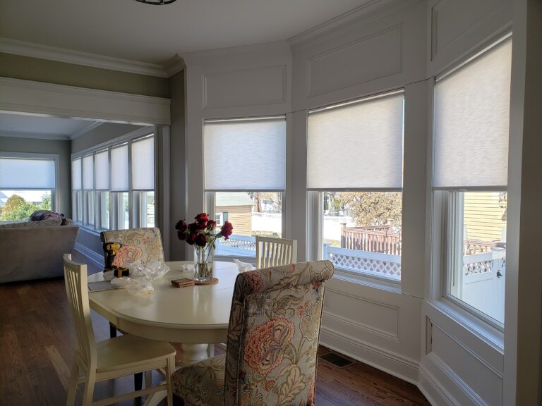 Custom roller shades fitted in a living room in Bergen County, NJ