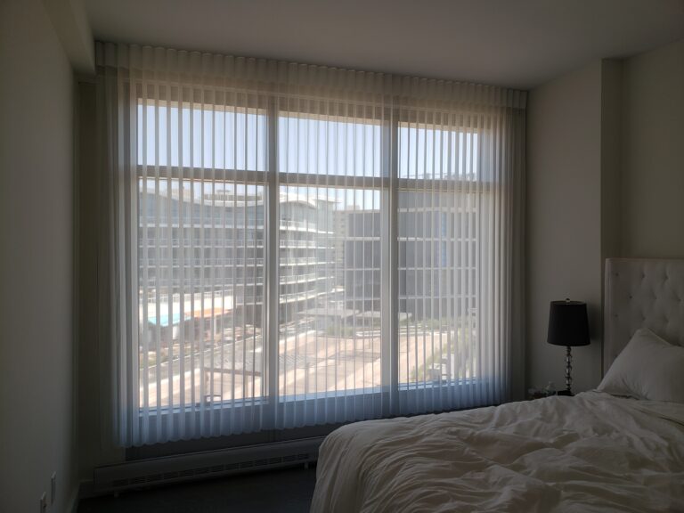 Vertical privacy sheers in a bedroom in a Bergen County home