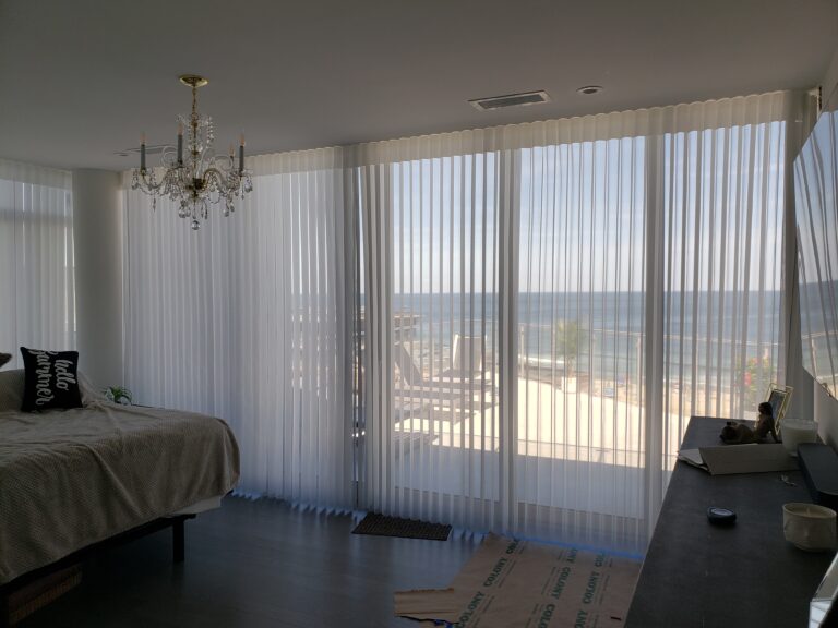 Sheer shadings measured and fitted for a Bergen County living room across floor-to-ceiling windows