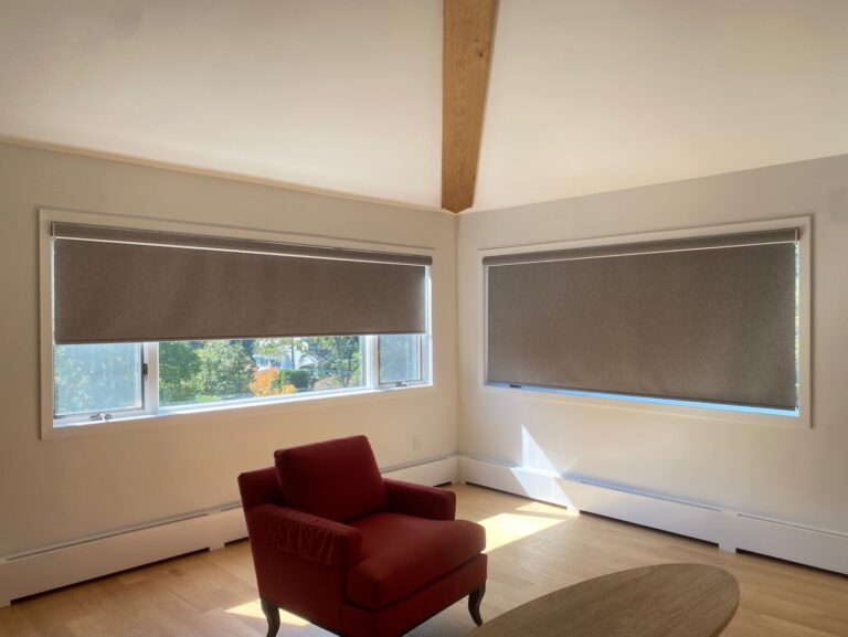 Roller shades installed in a New Jersey living room in a bay window
