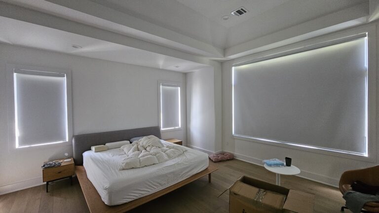 Roller shades in a bedroom