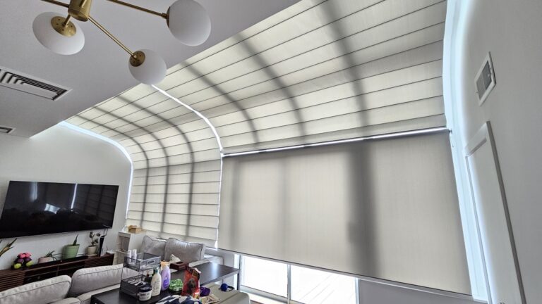 Specialty shaped shades fitted to an angled vaulted living room window