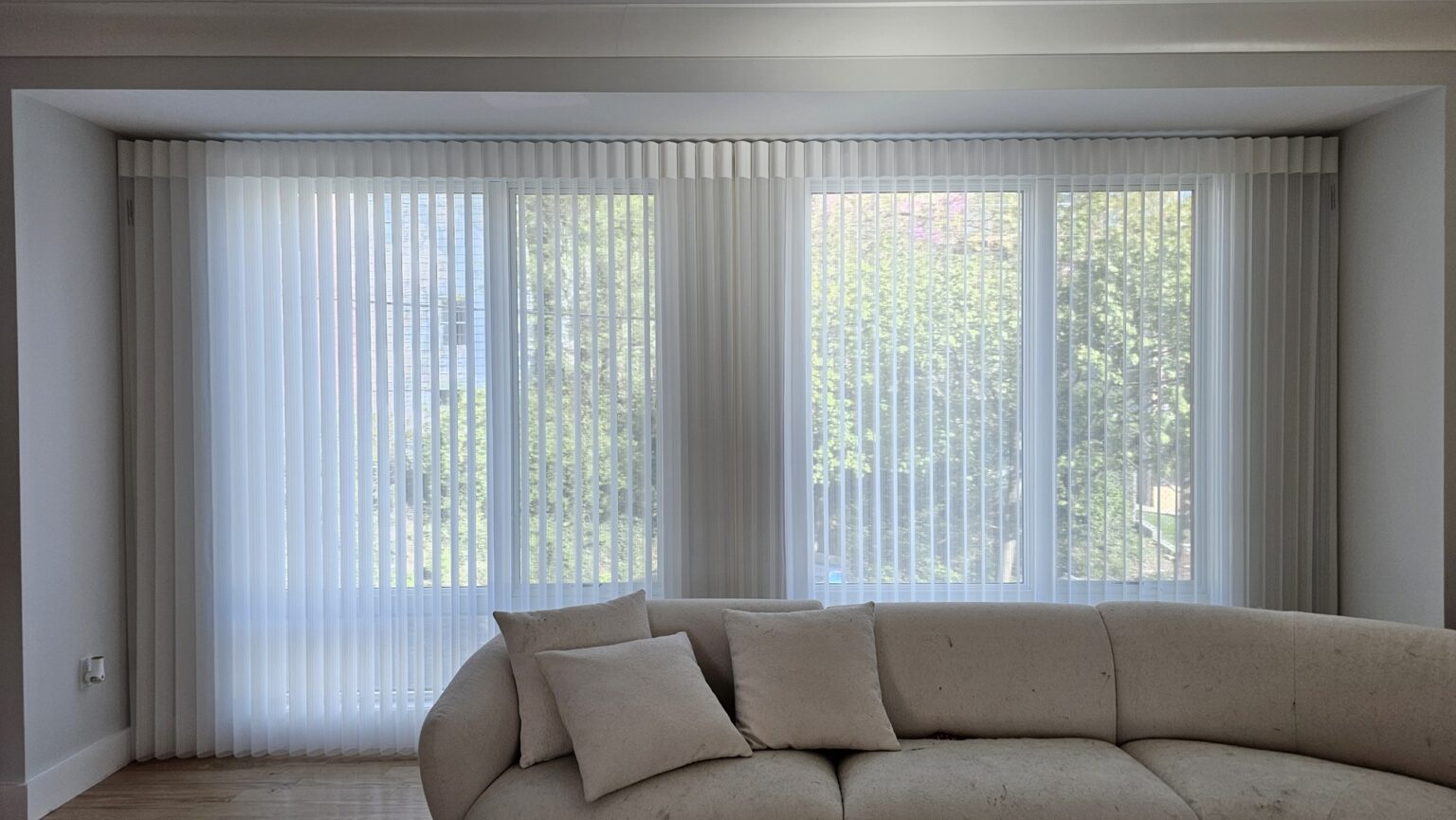Luminette privacy sheers softly filtering light across a wide sliding door