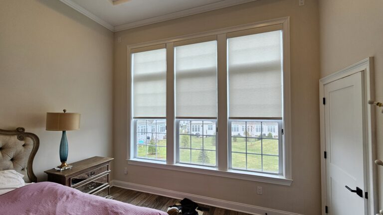 Plantation shutters in a Bergen County living room in a bay window
