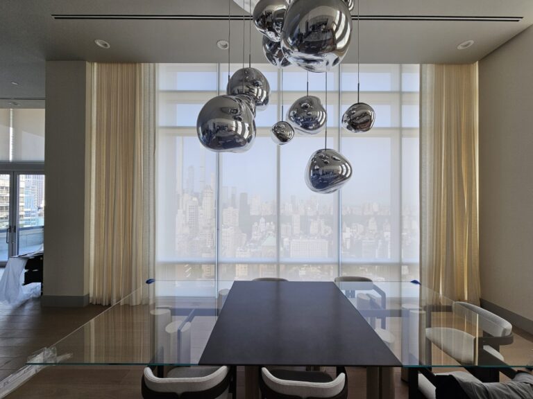 Custom drapery installed in a New Jersey living room across floor-to-ceiling windows