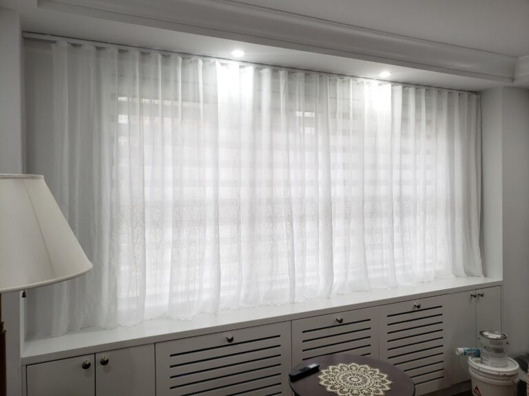 Sheer shadings installed in a New Jersey living room across floor-to-ceiling windows
