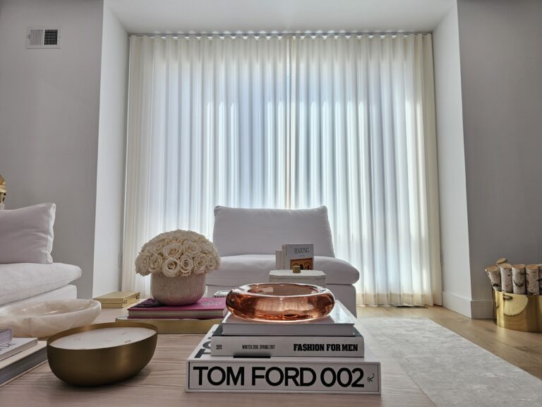 Custom drapery panels on floor to ceiling living room windows