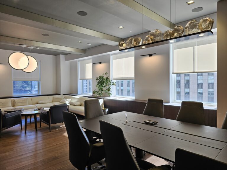 roller shades in a Tri-State living room across floor-to-ceiling windows, made to measure