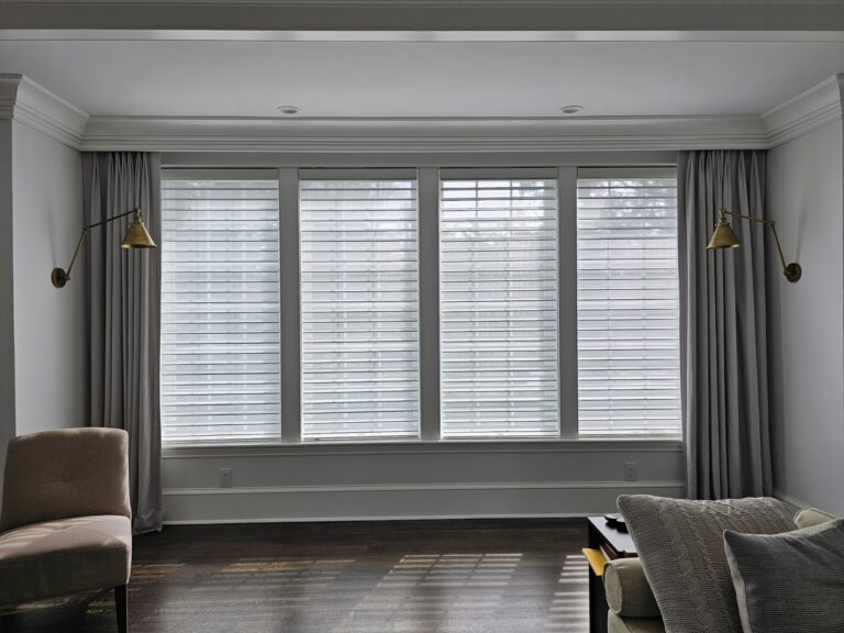 Sheer zebra shades in a living room across a bay window in a Bergen County home