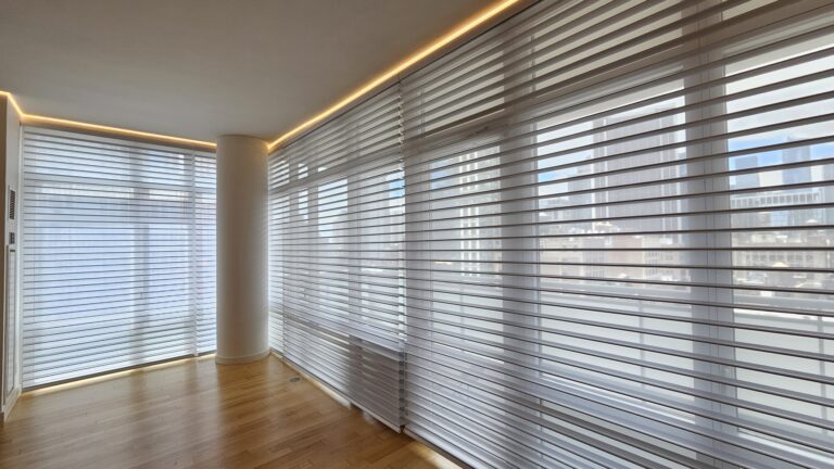 Sheer zebra shades on floor to ceiling windows