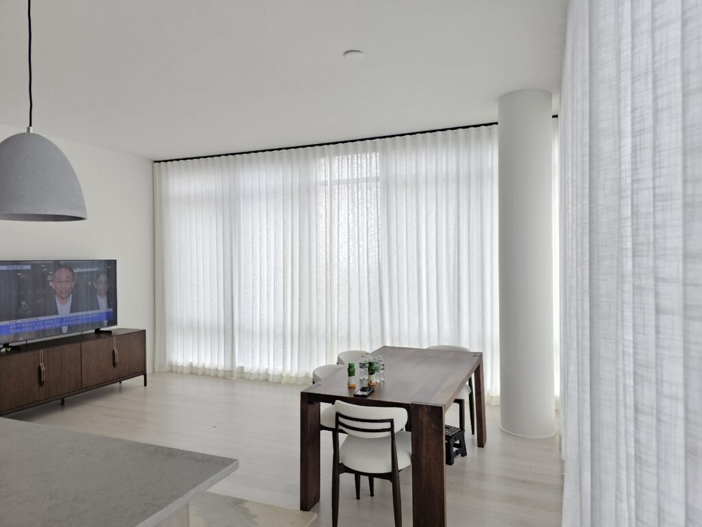 Custom drapery panels framing a large window
