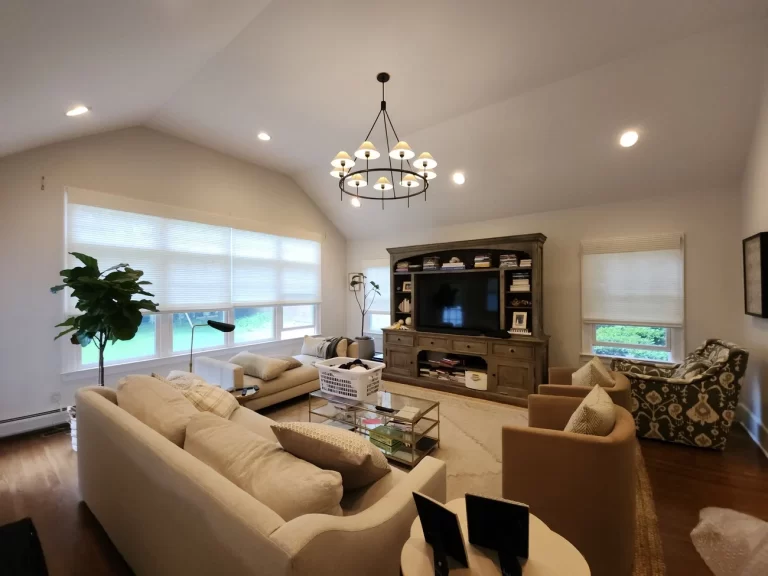 A finished living room transformed with custom window treatments