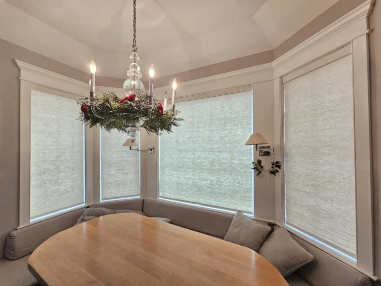 Bay window with sheer shades in a Tenafly home